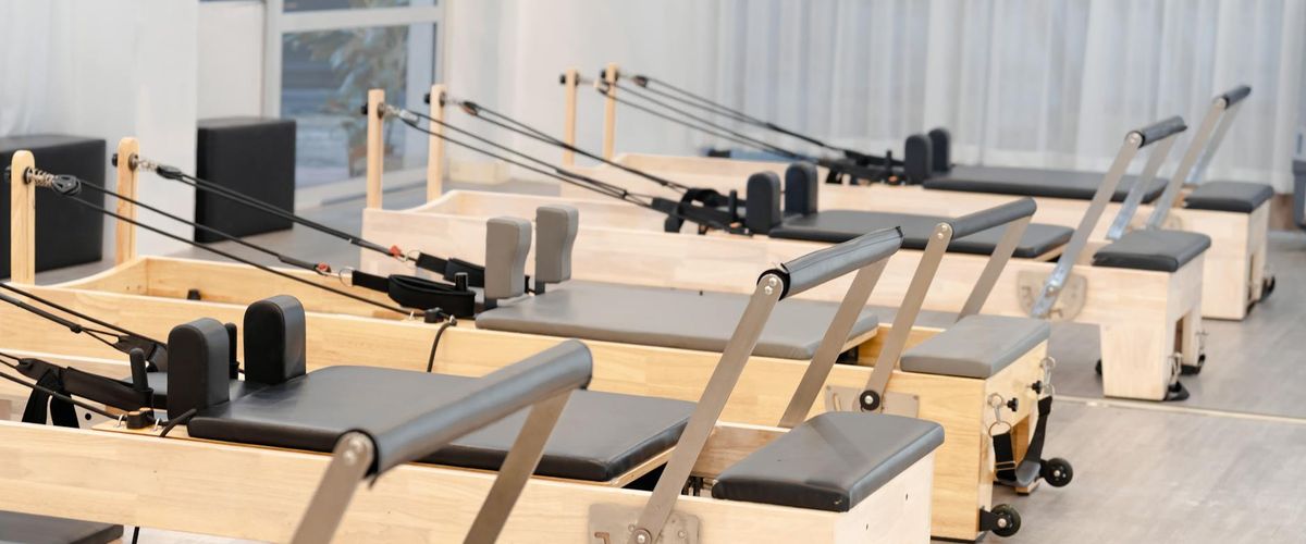 Wide shot of a modern minimalist exercise studio space.